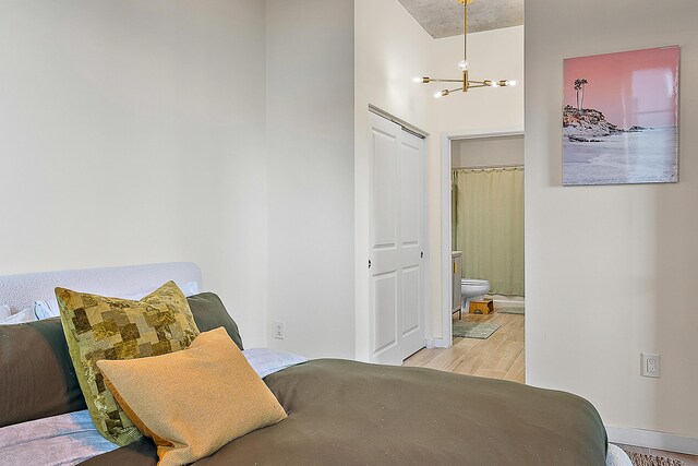 full bathroom featuring vanity, hardwood / wood-style flooring, shower / bath combo, and toilet