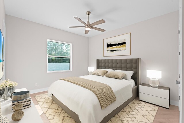 bedroom with ceiling fan and light hardwood / wood-style floors