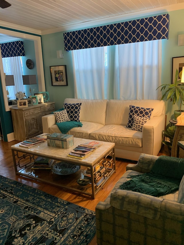 living room with hardwood / wood-style floors, wooden ceiling, and crown molding