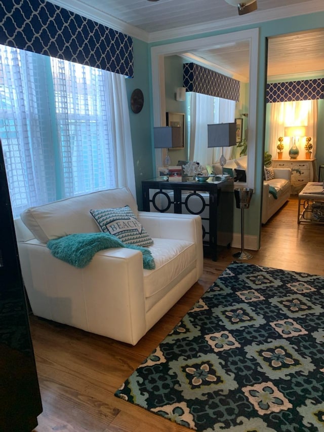 bedroom with hardwood / wood-style flooring and ornamental molding