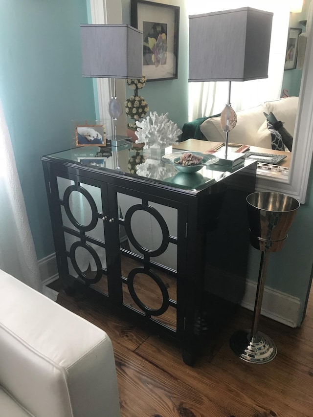 office with dark hardwood / wood-style flooring