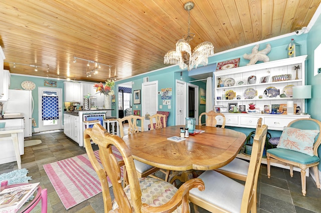 dining area with crown molding, wooden ceiling, and track lighting