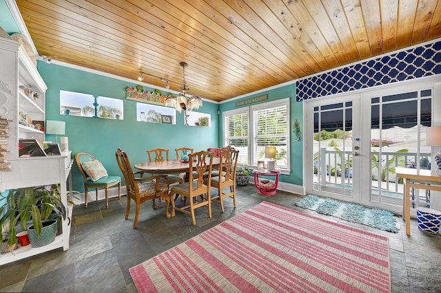 dining area with a chandelier, french doors, and wood ceiling