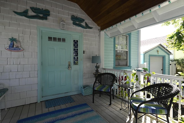 doorway to property with a porch