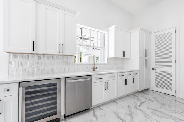 kitchen with dishwasher, decorative backsplash, white cabinetry, and beverage cooler