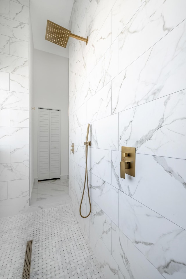 bathroom with tiled shower