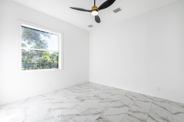 spare room featuring ceiling fan