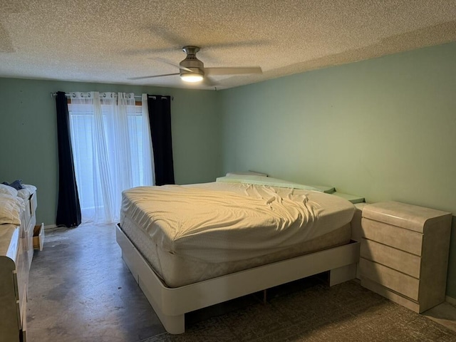 bedroom featuring a ceiling fan and a textured ceiling