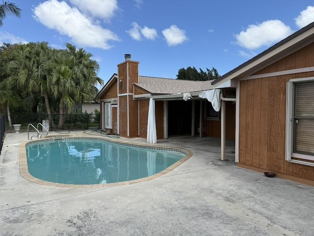 view of pool featuring a fenced in pool, a patio, and fence