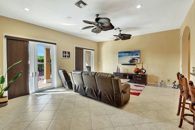 living room featuring ceiling fan and light tile patterned floors