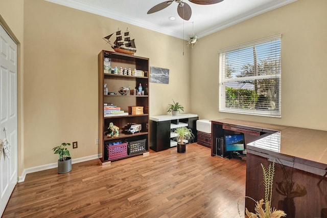 office area featuring hardwood / wood-style flooring, ceiling fan, and ornamental molding