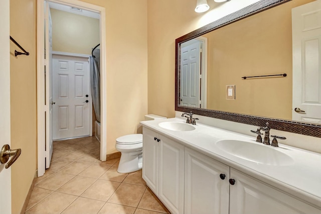 full bathroom with toilet, shower / tub combination, vanity, and tile patterned floors