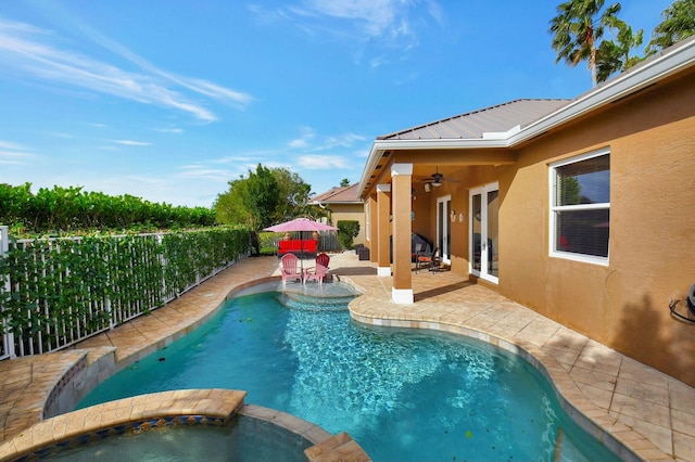 view of pool with an in ground hot tub, french doors, a patio, and ceiling fan