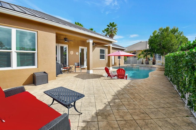 view of pool featuring ceiling fan and a patio