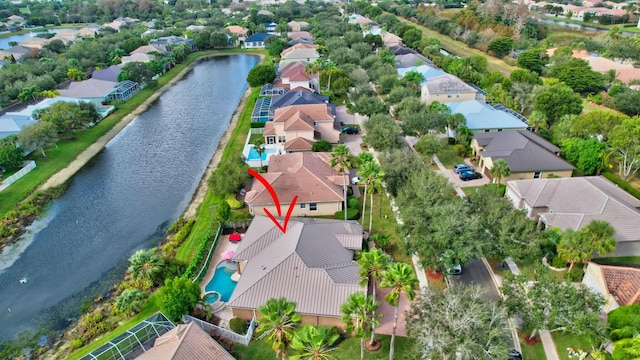 birds eye view of property with a water view