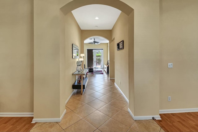 hallway with light hardwood / wood-style flooring