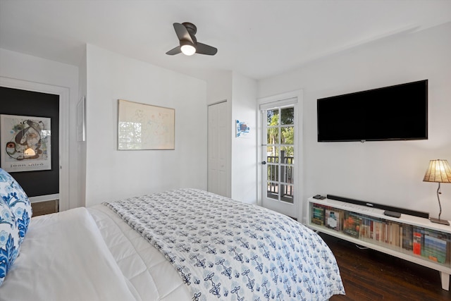 bedroom with a closet, dark hardwood / wood-style floors, and ceiling fan