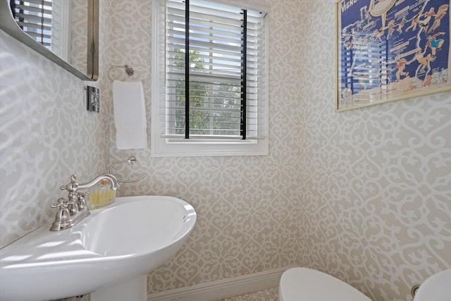 bathroom featuring toilet and sink