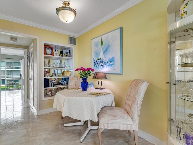 dining area with crown molding and a textured ceiling