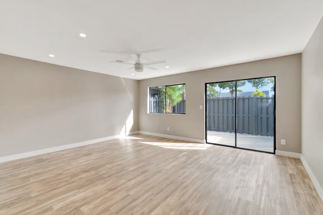 unfurnished room with ceiling fan and light hardwood / wood-style flooring