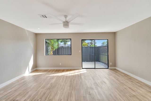 spare room with ceiling fan and light hardwood / wood-style flooring