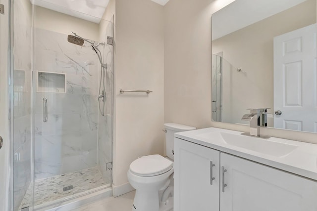 bathroom featuring vanity, toilet, and walk in shower