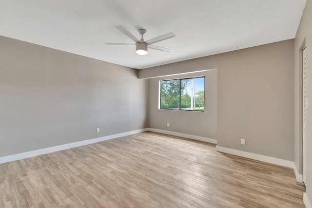 empty room featuring light hardwood / wood-style floors and ceiling fan