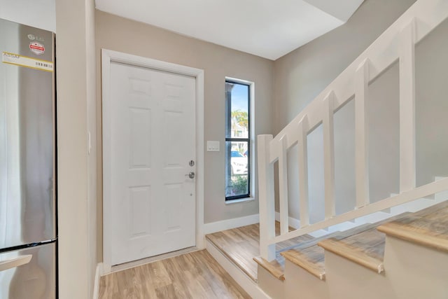 entrance foyer with light hardwood / wood-style floors