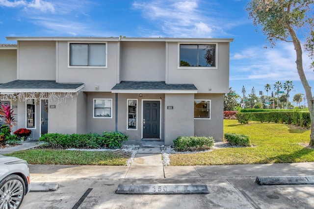 view of front of property with a front lawn