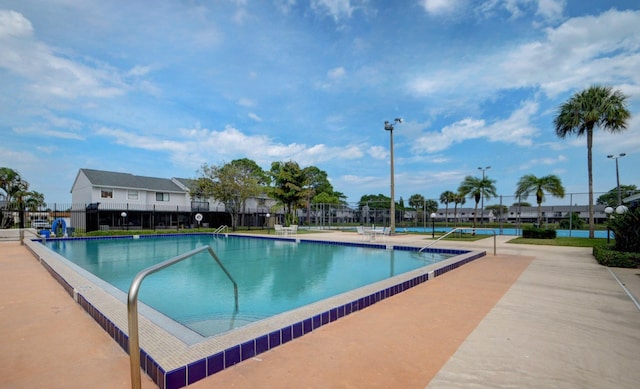 view of swimming pool featuring a patio area