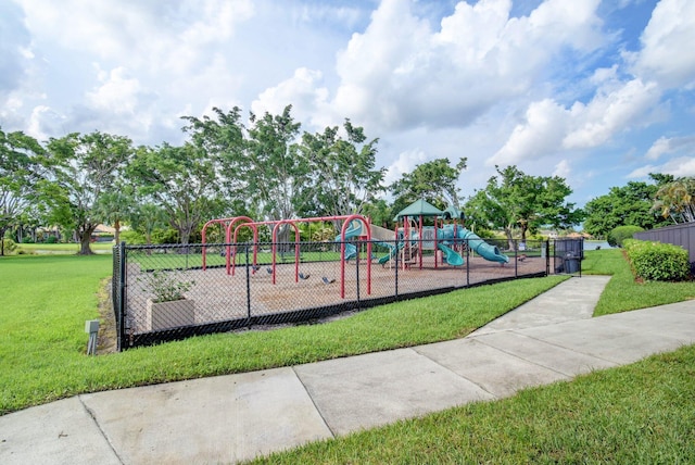 view of playground with a lawn