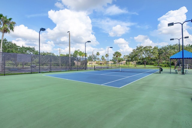 view of sport court featuring basketball hoop