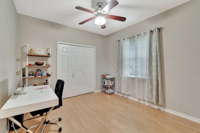 office space featuring hardwood / wood-style floors and ceiling fan