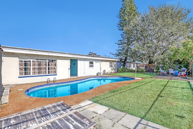 view of pool featuring a yard