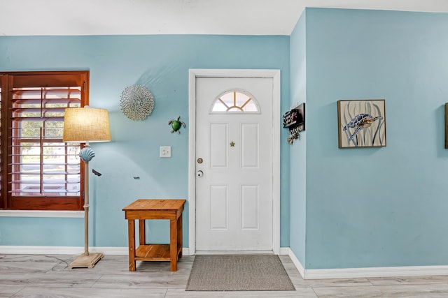 entrance foyer with light hardwood / wood-style flooring and plenty of natural light