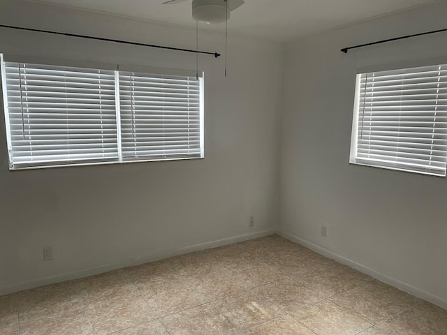 unfurnished room with ceiling fan