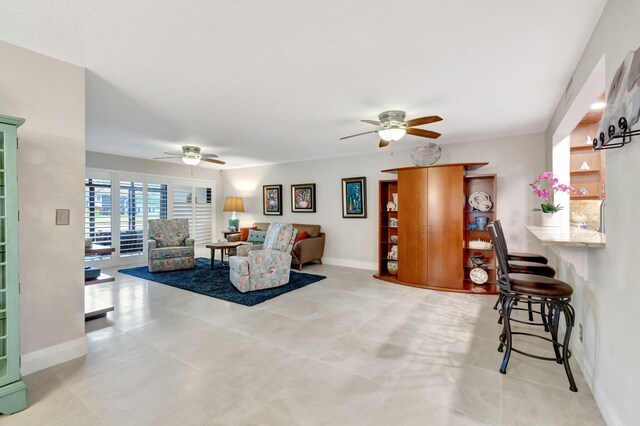 living room featuring ceiling fan