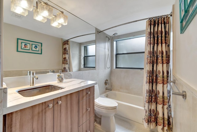 full bathroom with tile patterned flooring, vanity, shower / bath combination with curtain, and toilet