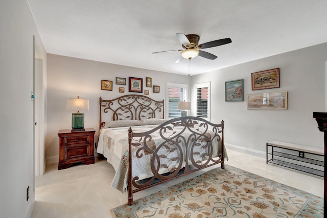 bedroom featuring light carpet and ceiling fan