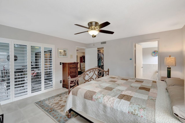 bedroom with ceiling fan, a closet, and a spacious closet