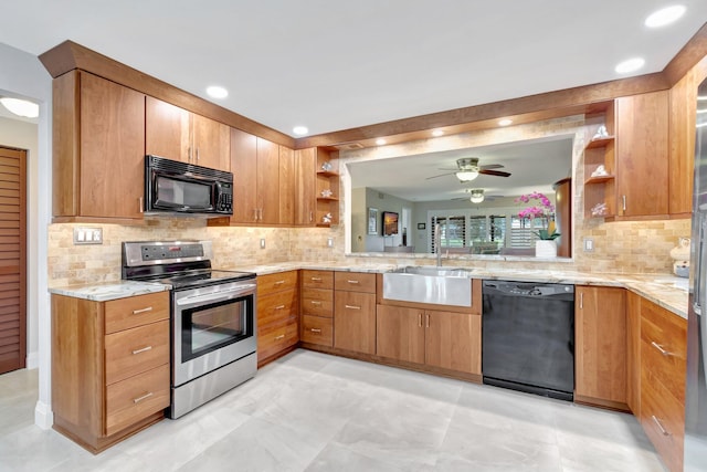 kitchen featuring black appliances, ceiling fan, sink, and tasteful backsplash