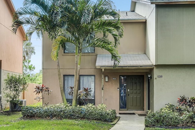 entrance to property featuring central AC unit