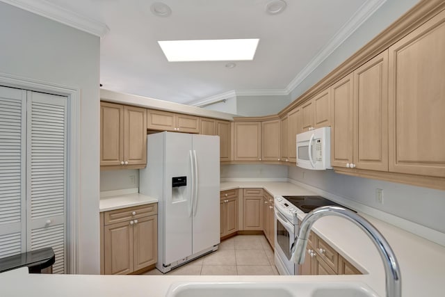 kitchen with light brown cabinets, white appliances, a skylight, ornamental molding, and light tile patterned floors