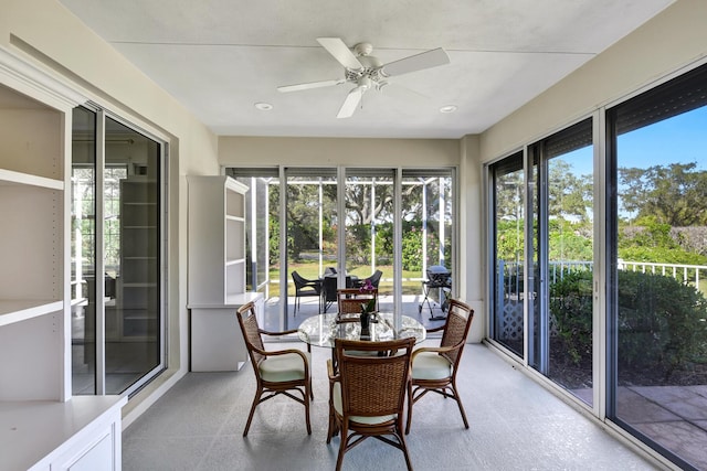 sunroom with plenty of natural light and ceiling fan