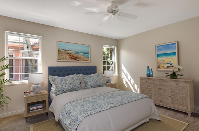 bedroom featuring multiple windows, carpet, and ceiling fan