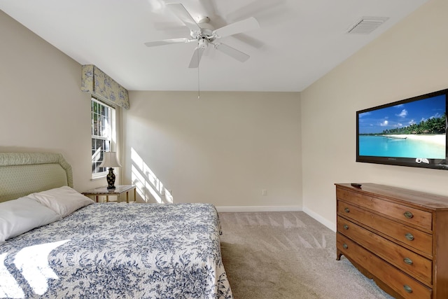 bedroom with ceiling fan and light carpet