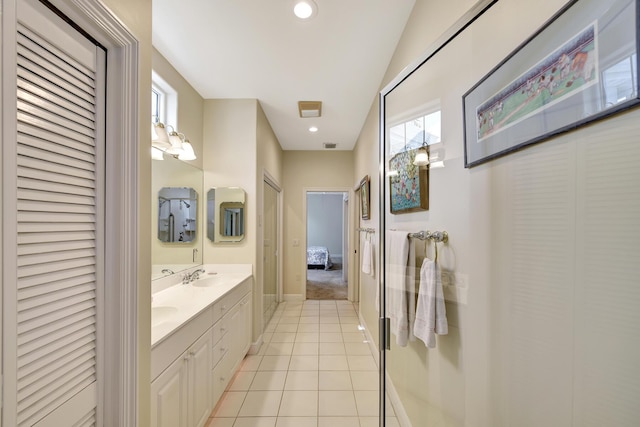 bathroom with tile patterned flooring and vanity