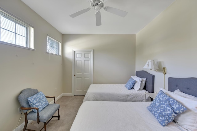 bedroom featuring ceiling fan and light colored carpet