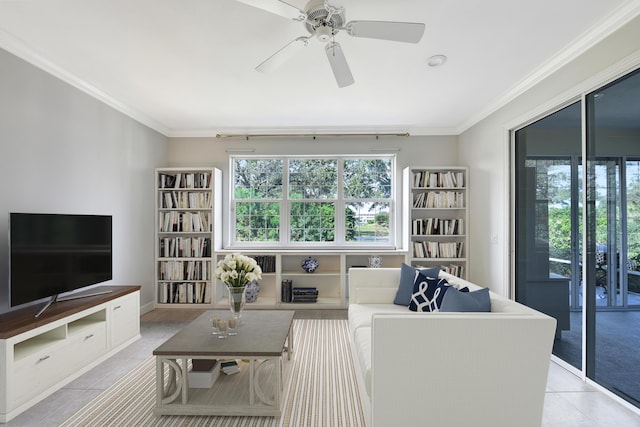 living room featuring ceiling fan, light tile patterned flooring, and ornamental molding