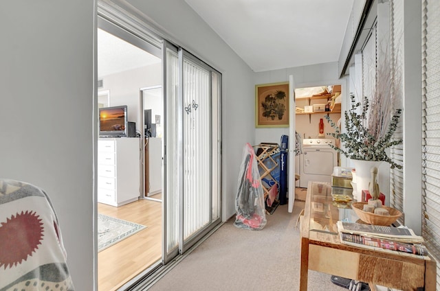 interior space with light hardwood / wood-style flooring and washer / dryer